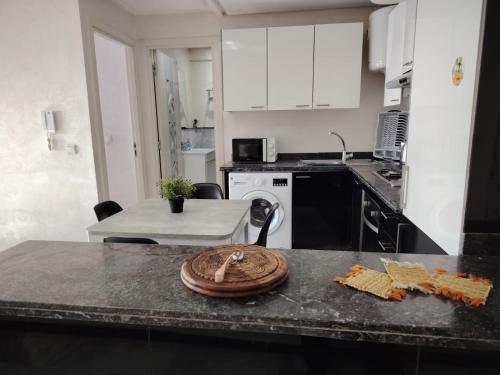 a kitchen with a counter top with food on it at AiM HOUSE in Marrakech