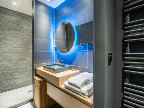 a bathroom with a sink and a mirror at Appartement Tignes, 3 pièces, 4 personnes - FR-1-641-35 in Tignes