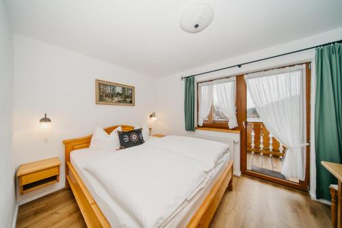 Katil atau katil-katil dalam bilik di Schwarzwald-Hotel Kraeutle