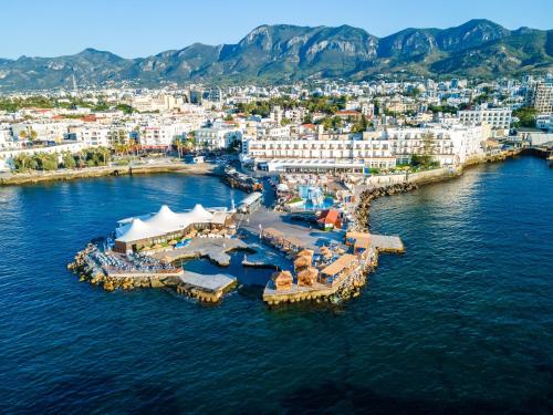 an aerial view of a resort in the water at DOME Hotel & Casino at Central Kyrenia in Kyrenia