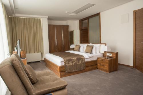 Postel nebo postele na pokoji v ubytování Hotel Royal Gold City