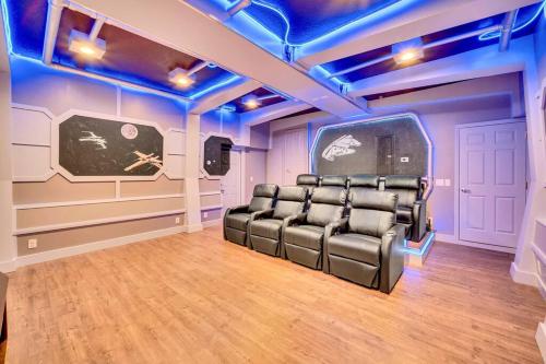 a room with a set of chairs in a room with blue lights at Enjoyable 6BR Home Near Disney in Orlando