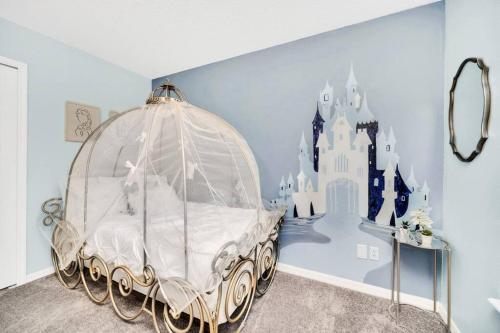 a bedroom with a castle themed bed in a room at Enjoyable 6BR Home Near Disney in Orlando