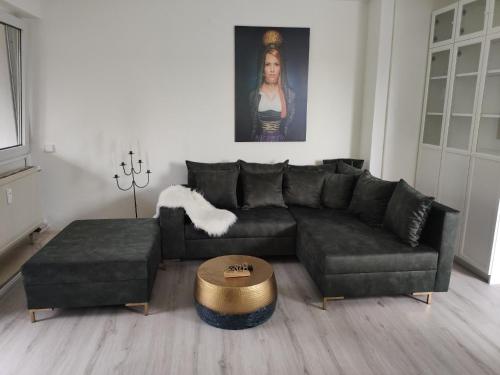a living room with a couch and a table at Romantik Ferienwohnung Bollenhut Superior in Lenzkirch