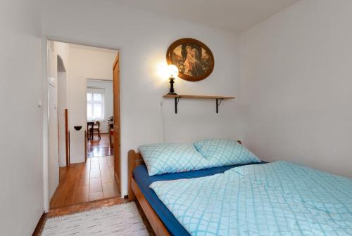 Postel nebo postele na pokoji v ubytování Apartmán Na náměstí