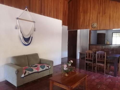 a living room with a couch and a table at Almendros House in Coco