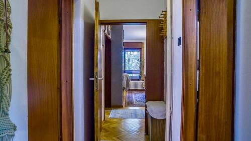 a hallway with a door leading into a room at 105 m2 Apartment in a Diplomatic Area in Belgrade