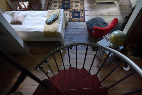 a view of a room with a bed and a chair at Henneviken BnB in Ed