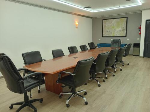 a conference room with a large wooden table and chairs at Holiday Inn Durango by IHG in Durango