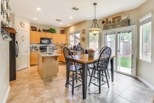 a kitchen with a wooden table and chairs at Private Yard Las Vegas Sanctuary on Cul-De-Sac in Las Vegas