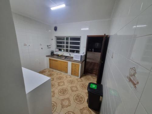 a small kitchen with a sink and a counter at Villa Fátima Hostel GRU in Guarulhos