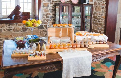 a table with a buffet of food on it at Quinta da Barroca Douro Valley in Armamar
