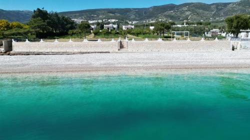 a body of water with mountains in the background at Olive&Sea Villa-OLIVE in Mattinata