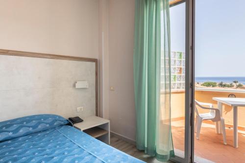 Posteľ alebo postele v izbe v ubytovaní Hotel Residence Isola Verde
