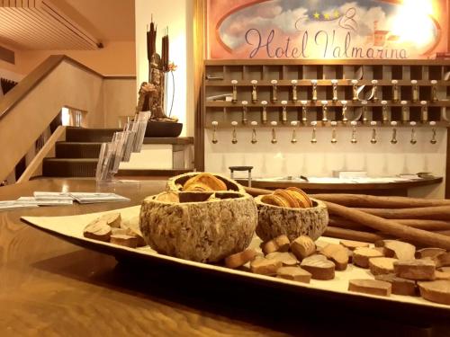 a tray of bread and pastries on a table at Valmarina in Calenzano