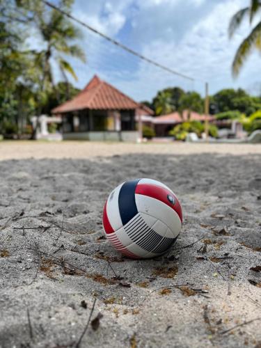a volleyball sitting on the ground in front of a house at Mia Nueva Gorgona in Nueva Gorgona