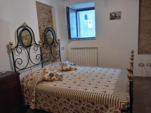 Ένα ή περισσότερα κρεβάτια σε δωμάτιο στο Casa Borgo Fonte