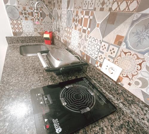 a book sitting on top of a bathroom counter at Departamento bonito y acogedor cerca de todo! in Asuncion