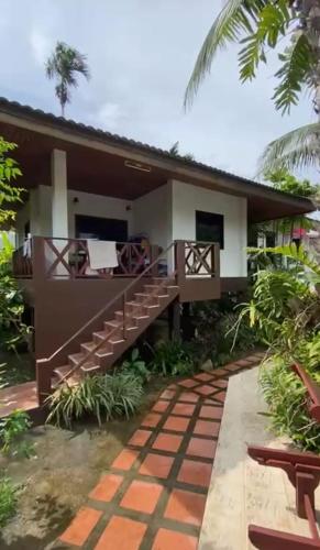 a view of a house with a balcony at Tulum resort & spa in Amphoe Koksamui