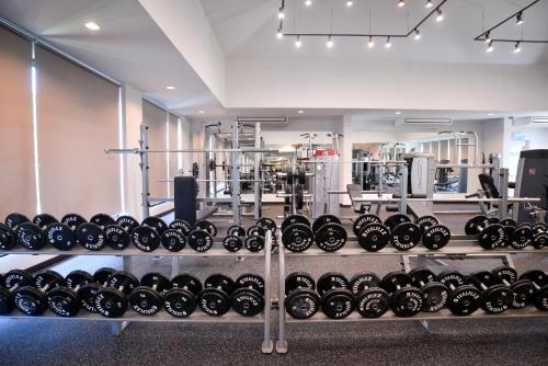 a rack of dumbbells in a gym at Coco View Hotel in Samut Songkhram