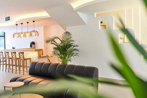 a living room with a couch and a table at Audo Local in Antalya
