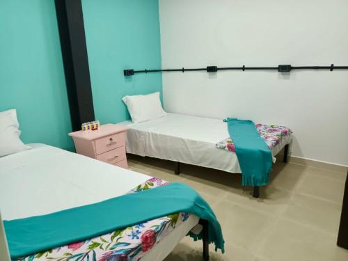 Una cama o camas en una habitación de Casa Mango
