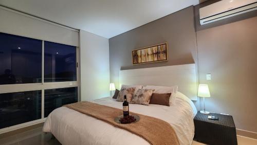 Katil atau katil-katil dalam bilik di APARTAMENTO DE LUJO PARA PAREJAS