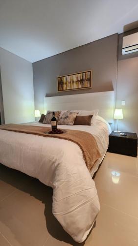 Katil atau katil-katil dalam bilik di APARTAMENTO DE LUJO PARA PAREJAS