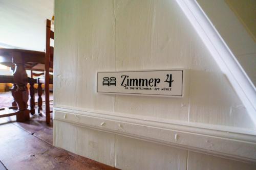 a sign on the side of a wall at Alandblick in Wanzer