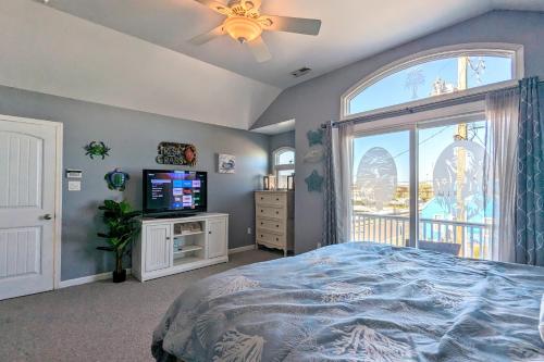 a bedroom with a bed and a tv and a window at Waves n Wooder by AvantStay SwimSpa Game Room Walk to Beach in Wildwood