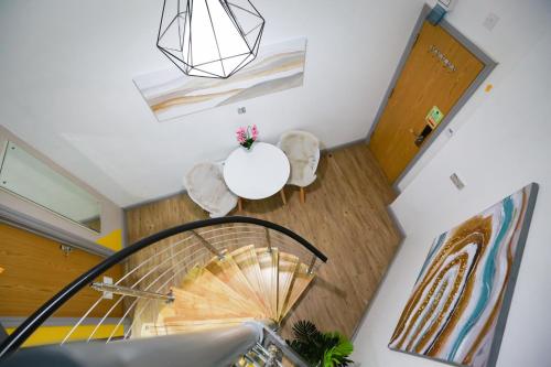 an overhead view of a spiral staircase in a house at E104 Urban loft gem in Coventry