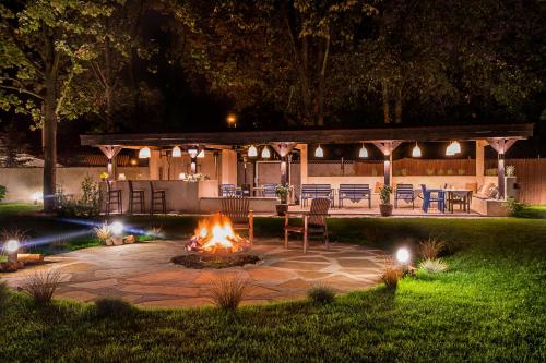 a fire pit in the middle of a yard at night at Złoty Lin in Serock
