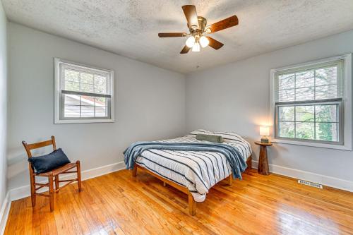 a bedroom with a bed and a ceiling fan at Eclectic Winston-Salem Home 3 Mi to Downtown! in Winston-Salem