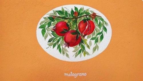 une peinture d'une plaque portant des tomates dans l'établissement Wohnung in Toscolano Maderno mit Garten, Grill und Terrasse, à Toscolano Maderno