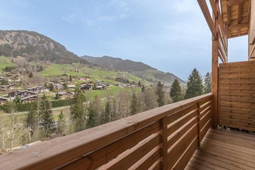 a balcony with a view of a mountain at Magnificent chalet with view in Praz-sur-Arly - Welkeys in Praz-sur-Arly