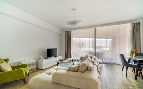 a living room with a couch and a table at Amare Luxury Apartments in Budva