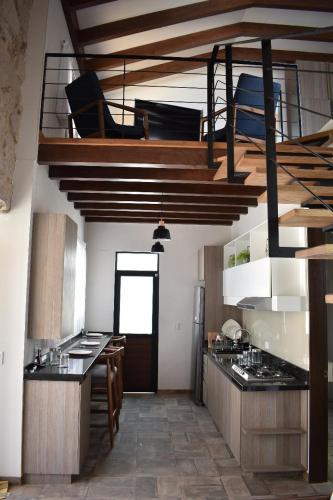 a kitchen with a loft bed in a room at Loft Montenegro in Aguascalientes