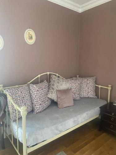 a bed with pillows on it in a room at Bealkelly Country House in Killaloe