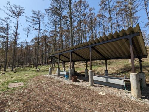 a pavilion in a field with trees in the background at Nagano Forest Village (former name: Iizuna Kogen C - Vacation STAY 36544v in Nagano