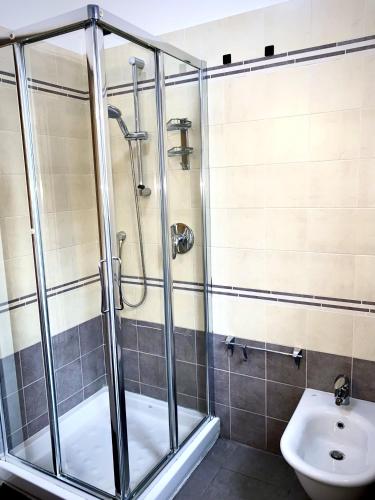 a bathroom with a shower and a toilet at Casa Langhetto in Grinzane Cavour