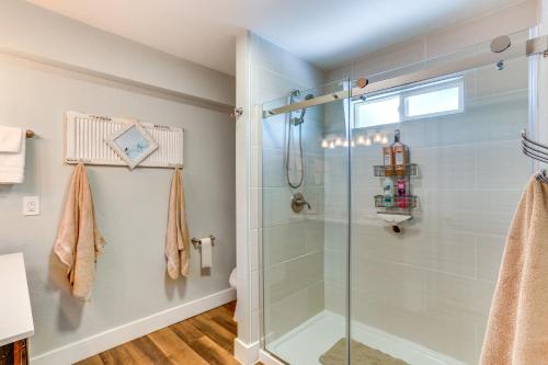 a bathroom with a shower with a glass door at Quiet Redding Getaway about 7 Mi to Downtown! in Redding