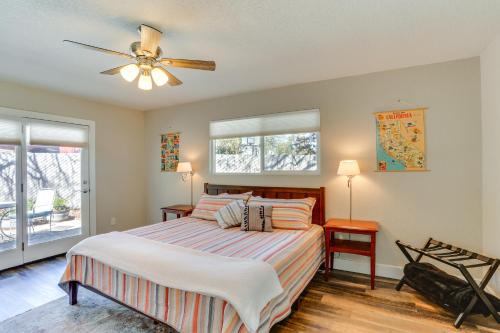 a bedroom with a bed and a ceiling fan at Quiet Redding Getaway about 7 Mi to Downtown! in Redding