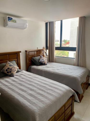 Postel nebo postele na pokoji v ubytování Alojamiento céntrico