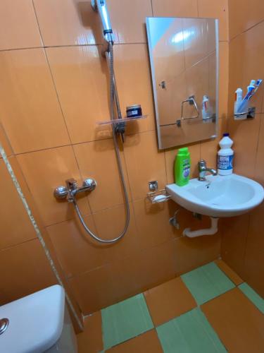 a bathroom with a shower and a sink at Marko Apartament 