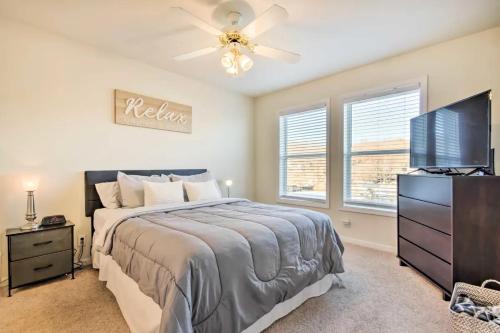 a bedroom with a bed and a flat screen tv at Waterfront Condo with Boat Slip! in Lake Ozark