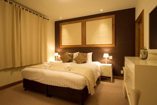 a bedroom with a bed with two towels on it at Annabelle - Vacation STAY 28455v in Niseko