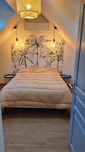 En eller flere senge i et værelse på Au Cœur des vignes