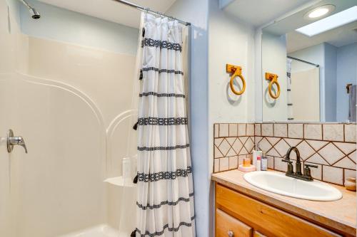 a bathroom with a shower and a sink at Adobe St David Vacation Rental Near River! 