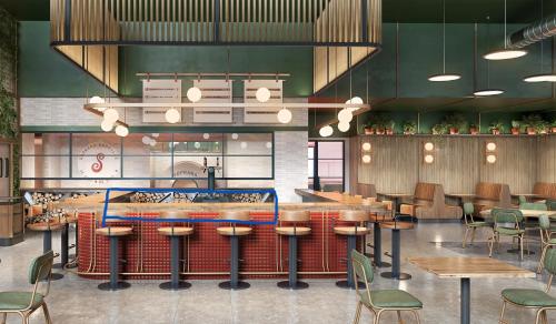 a restaurant with a bar with wooden tables and chairs at Embassy Suites By Hilton Asheville Downtown in Asheville
