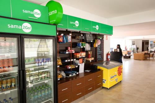 a santa clara soda shop with a drink cooler in a store at Casa Andina Select Zorritos Tumbes in Zorritos
